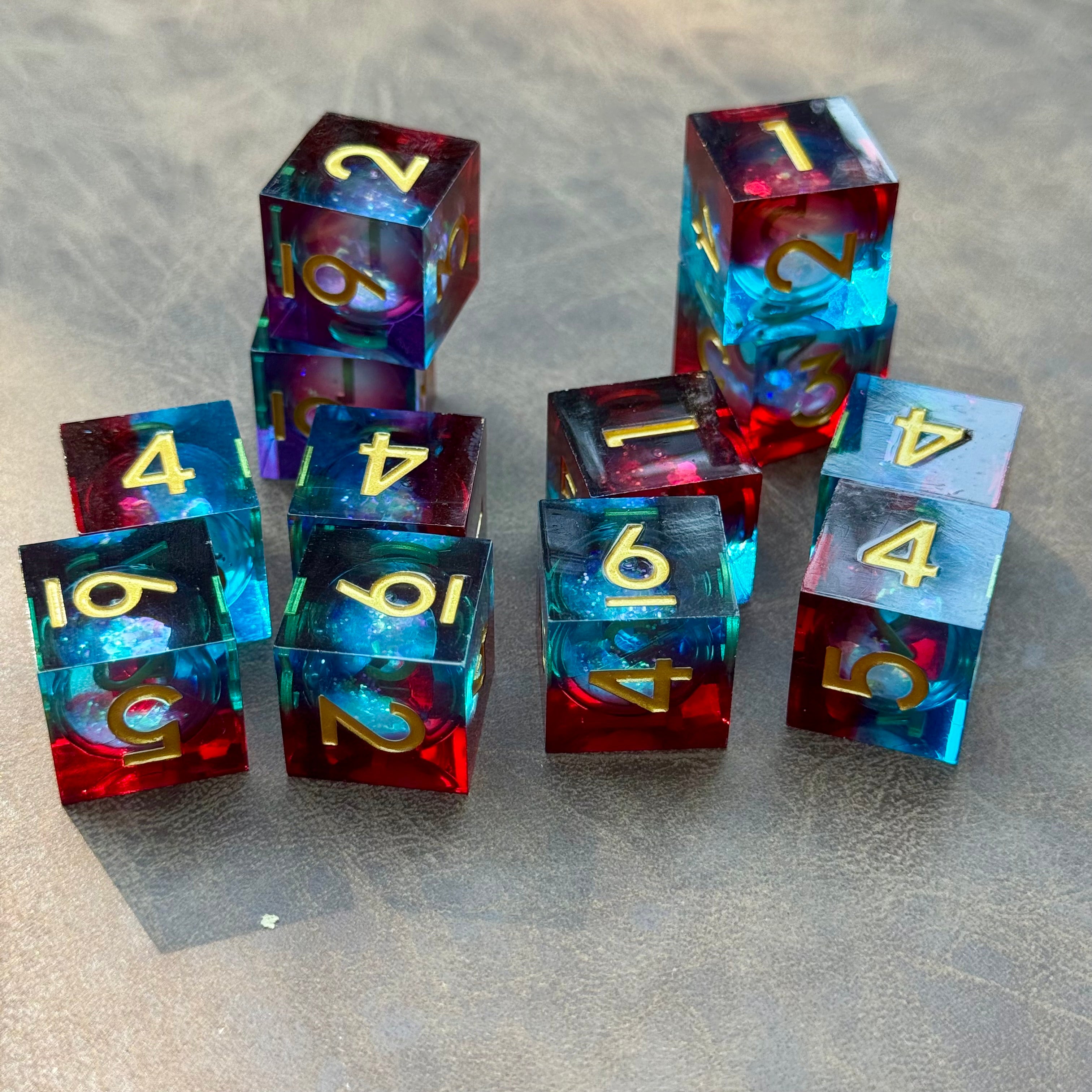 Celestial Flame set of twelve crimson, turquoise and violet liquid-core D6 dice