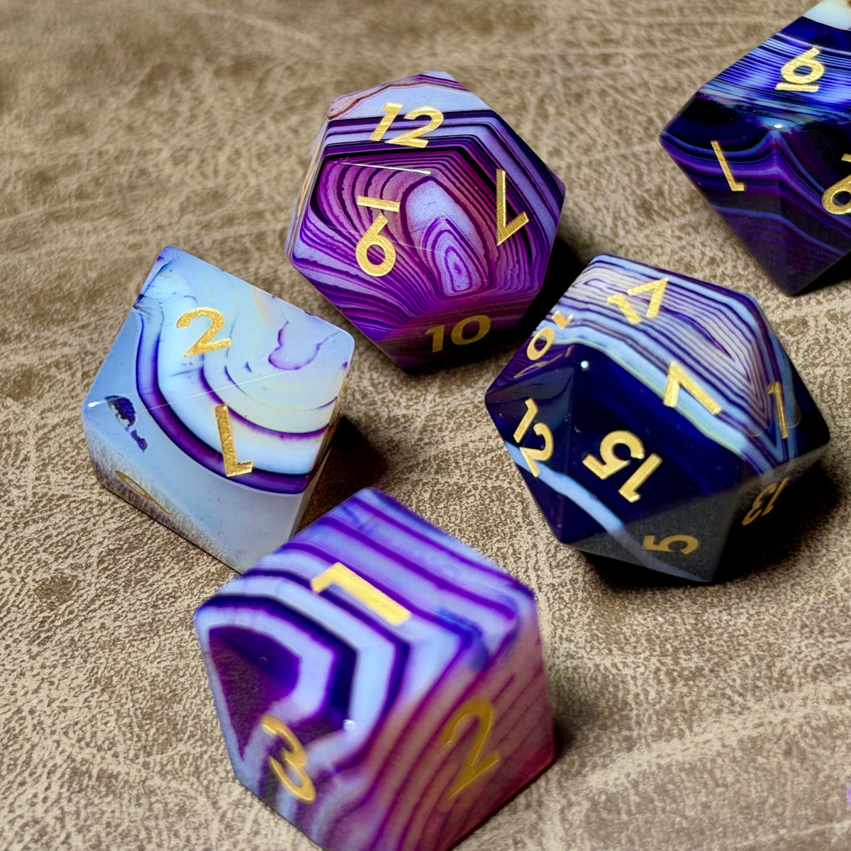 Violet Strata natural stone dice set with violet layers and gold numbering