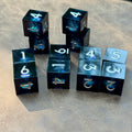 Midnight Vortex set of twelve near-black liquid-core D6 dice with silver numbers