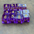 Violet Convergence set of twelve purple liquid-core D6 dice with gold numbers