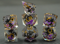 Shadow Wyrm clear liquid core RPG dice with black dragon artwork, purple shimmer and gold numbers