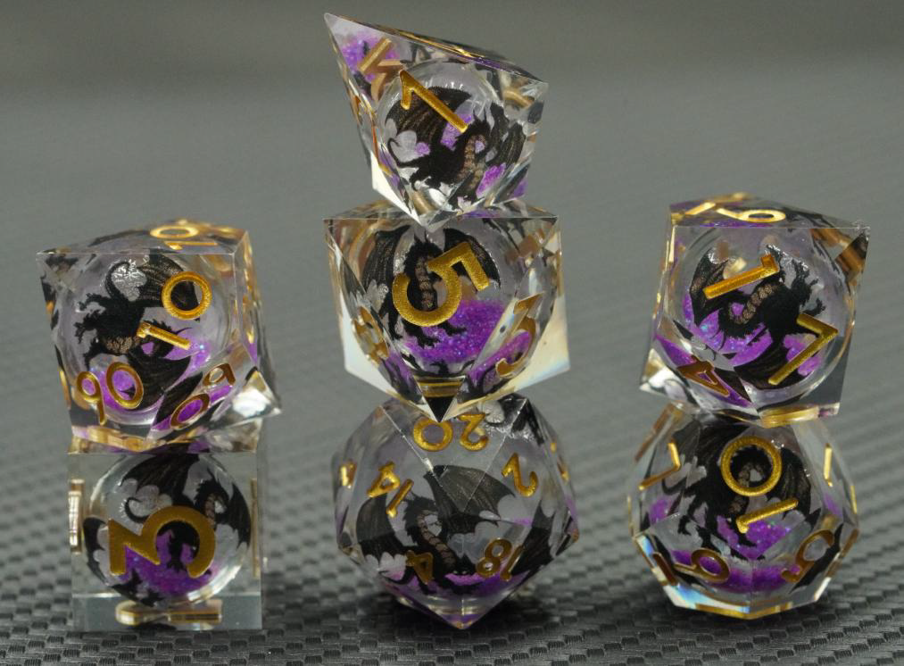 Shadow Wyrm clear liquid core RPG dice with black dragon artwork, purple shimmer and gold numbers