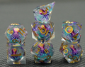 Tideglass Oracle clear liquid core RPG dice with colourful octopus inserts and gold numbers